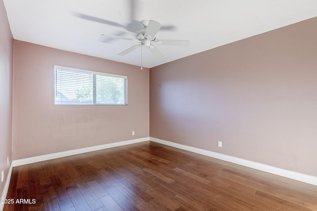 8713 E Sage Dr, Scottsdale, AZ 85250 - spare room with wood finished floors, a ceiling fan, and baseboards