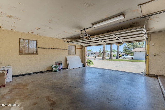 8713 E Sage Dr, Scottsdale, AZ 85250 - garage with a garage door opener and concrete block wall