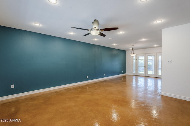 8713 E Sage Dr, Scottsdale, AZ 85250 - unfurnished room featuring baseboards, finished concrete floors, recessed lighting, a ceiling fan, and french doors