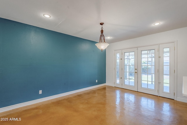 8713 E Sage Dr, Scottsdale, AZ 85250 - unfurnished room with finished concrete flooring, baseboards, recessed lighting, and french doors
