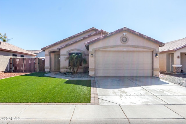 view of front of property featuring a garage and a front lawn