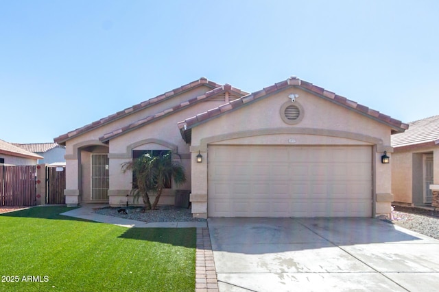 view of front of property with a garage and a front lawn