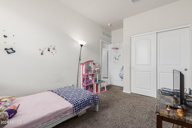 carpeted bedroom featuring a closet