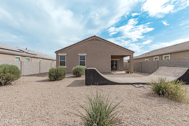 back of house with a patio