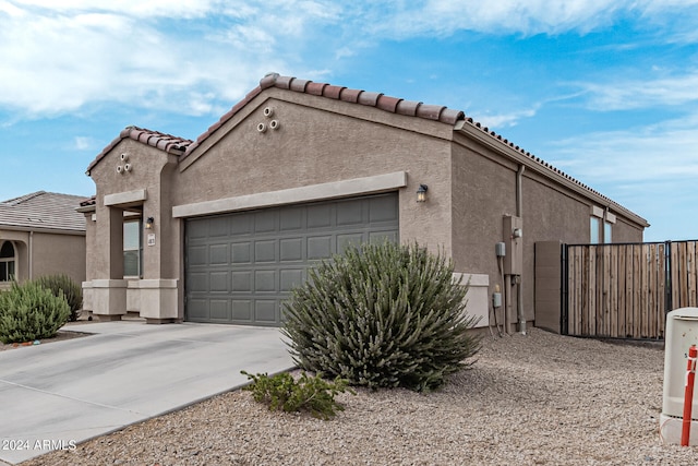 view of property exterior featuring a garage