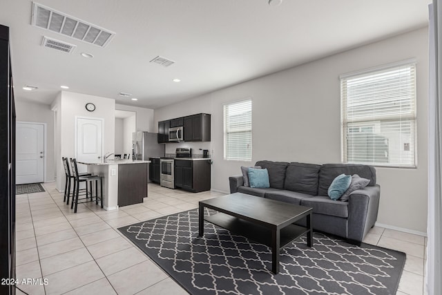 living room with light tile patterned floors