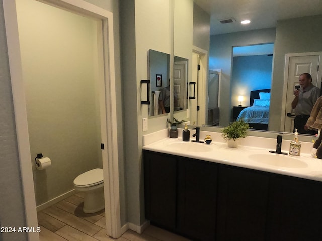 bathroom with vanity and toilet