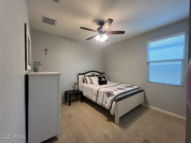 bedroom with light carpet and ceiling fan