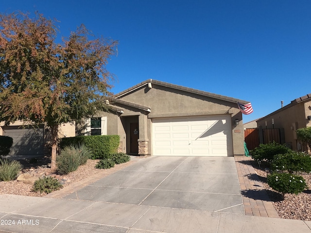 single story home featuring a garage