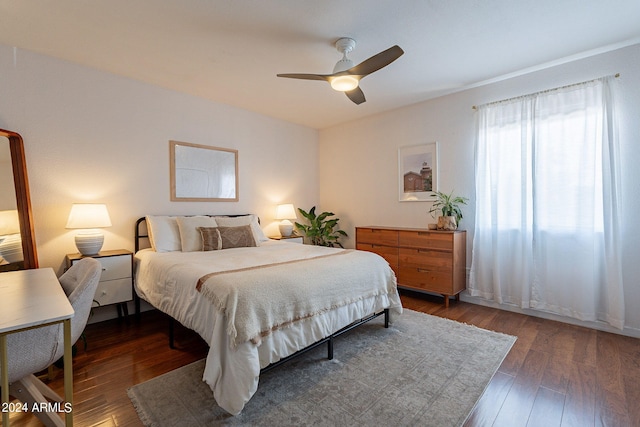 bedroom featuring ceiling fan and dark hardwood / wood-style floors