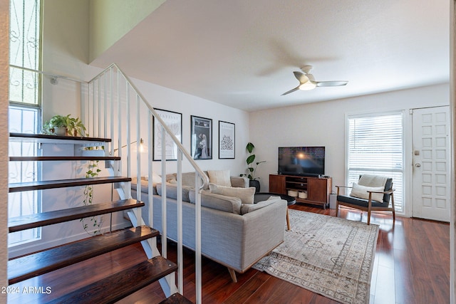 living room with wood-type flooring and ceiling fan