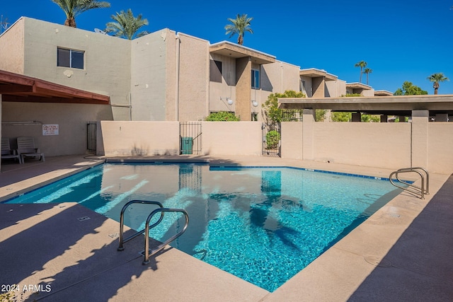 view of swimming pool featuring a patio