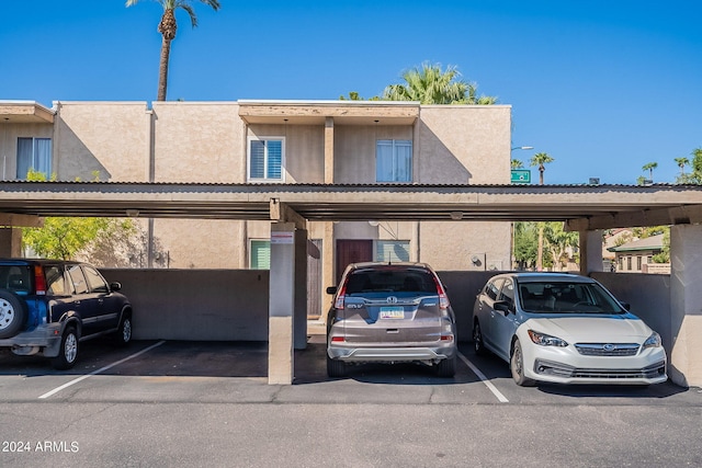 view of parking / parking lot with a carport