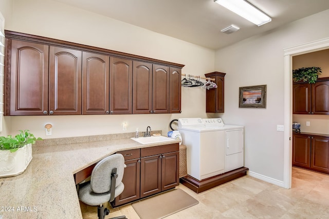 clothes washing area with washer and clothes dryer, cabinets, sink, and light tile flooring