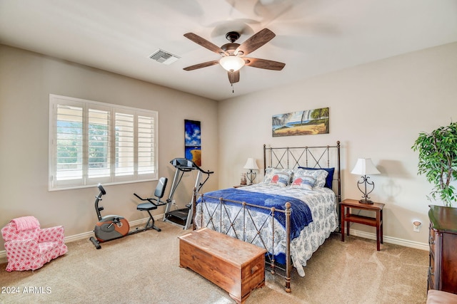 bedroom featuring ceiling fan and carpet