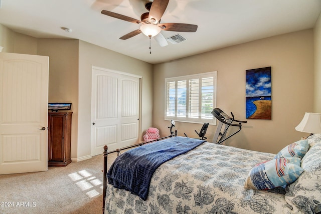 bedroom featuring a closet, ceiling fan, and carpet flooring