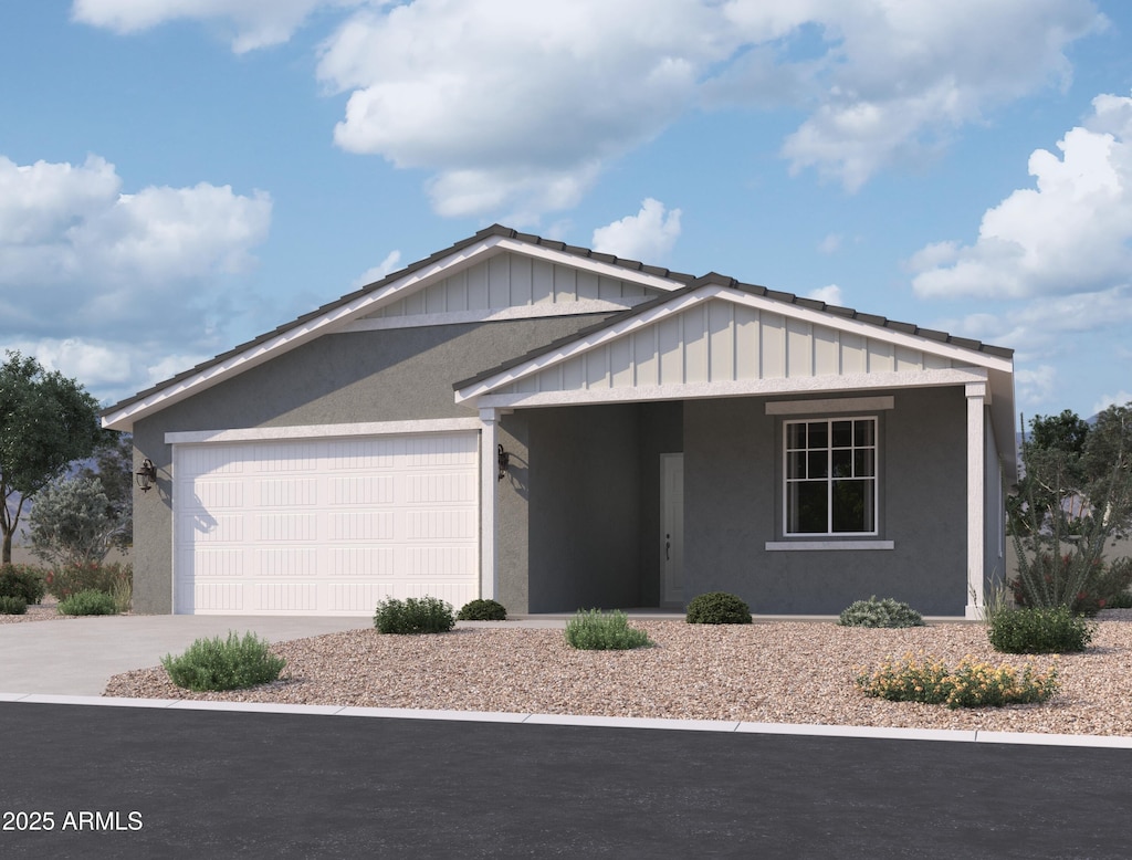 4509 S 95th Dr, Tolleson, AZ 85353 - view of front of home featuring stucco siding, driveway, and an attached garage