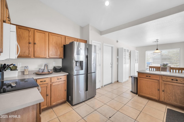7405 W Elwood St, Phoenix, AZ 85043 - kitchen with stainless steel refrigerator with ice dispenser, light countertops, brown cabinets, and light tile patterned floors