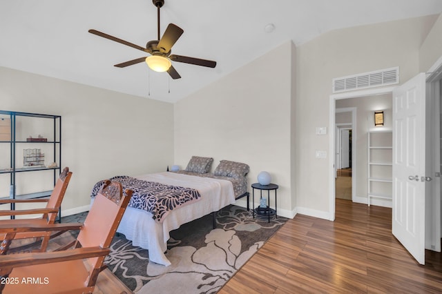 7405 W Elwood St, Phoenix, AZ 85043 - bedroom featuring wood finished floors, lofted ceiling, baseboards, and ceiling fan