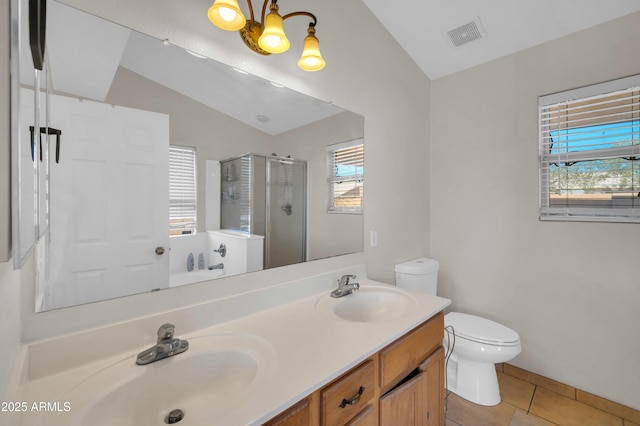 7405 W Elwood St, Phoenix, AZ 85043 - full bath with lofted ceiling, plenty of natural light, toilet, a stall shower, and tile patterned floors