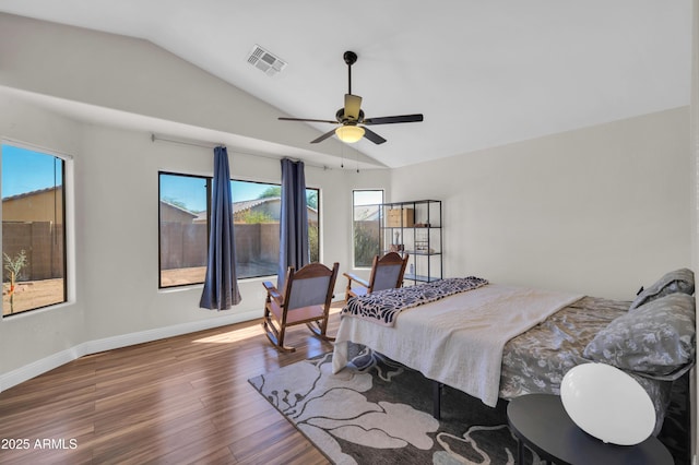 7405 W Elwood St, Phoenix, AZ 85043 - bedroom with vaulted ceiling, wood finished floors, multiple windows, baseboards, and a ceiling fan