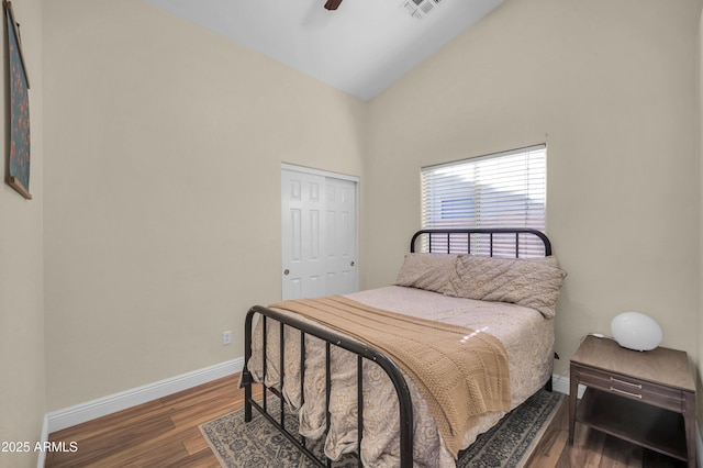 7405 W Elwood St, Phoenix, AZ 85043 - bedroom featuring baseboards, high vaulted ceiling, wood finished floors, a closet, and ceiling fan