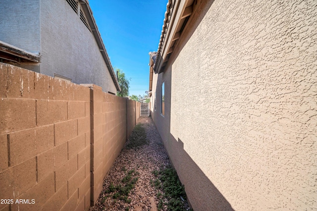 7405 W Elwood St, Phoenix, AZ 85043 - view of side of property with stucco siding and fence