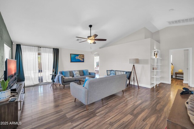 7405 W Elwood St, Phoenix, AZ 85043 - living room with ceiling fan, wood finished floors, vaulted ceiling, arched walkways, and baseboards