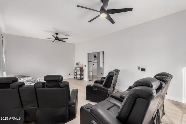 living room featuring ceiling fan and light wood-type flooring