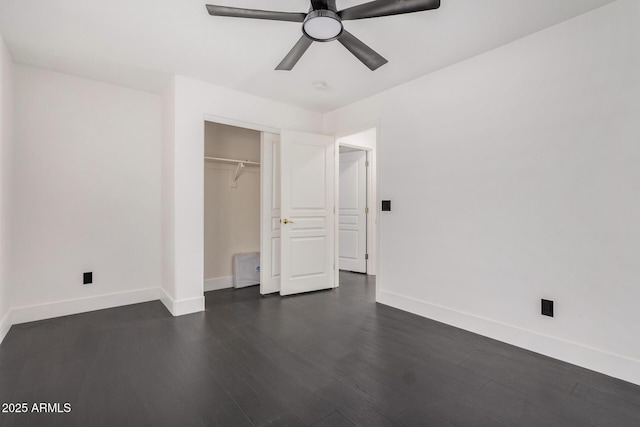 unfurnished bedroom featuring dark hardwood / wood-style flooring, a closet, and ceiling fan