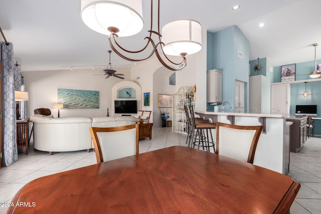 dining space featuring high vaulted ceiling, ceiling fan, and light tile patterned floors