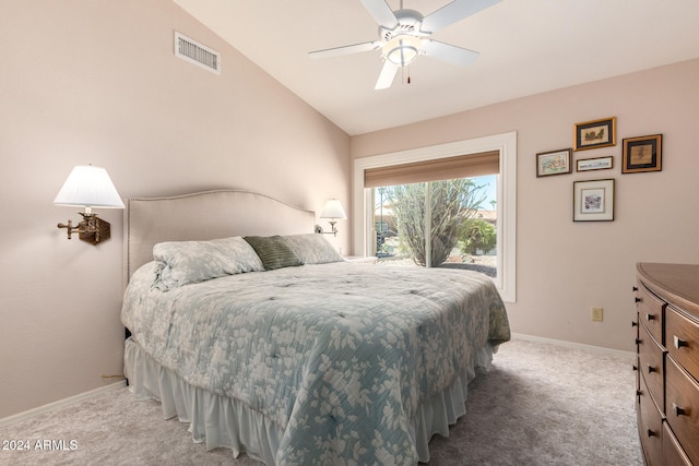 carpeted bedroom with vaulted ceiling and ceiling fan