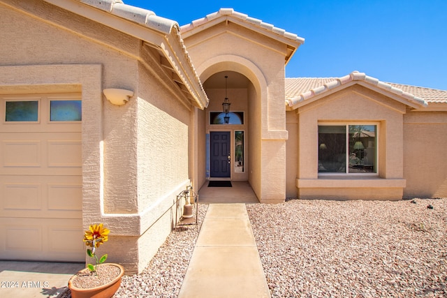 entrance to property featuring a garage