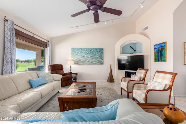 living room featuring rail lighting, ceiling fan, and light tile patterned floors