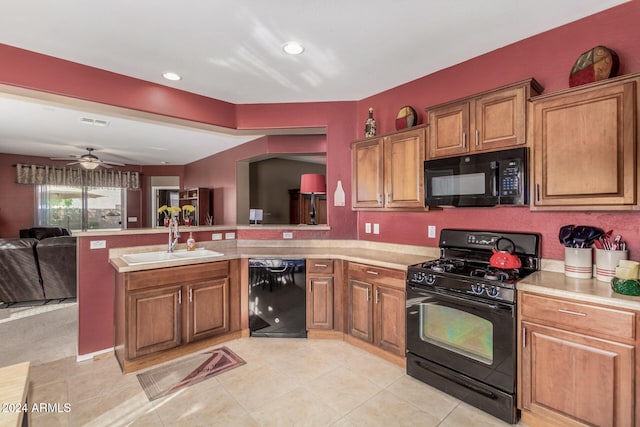 kitchen featuring black appliances, ceiling fan, light tile patterned floors, sink, and kitchen peninsula