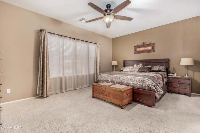 bedroom featuring light carpet and ceiling fan