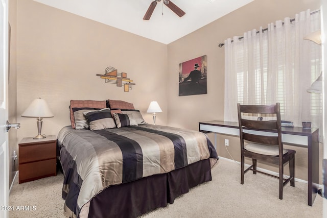 bedroom with light carpet and ceiling fan