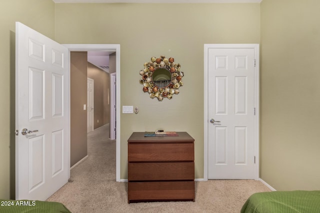 bedroom featuring light colored carpet