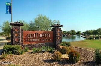 community sign with a water view