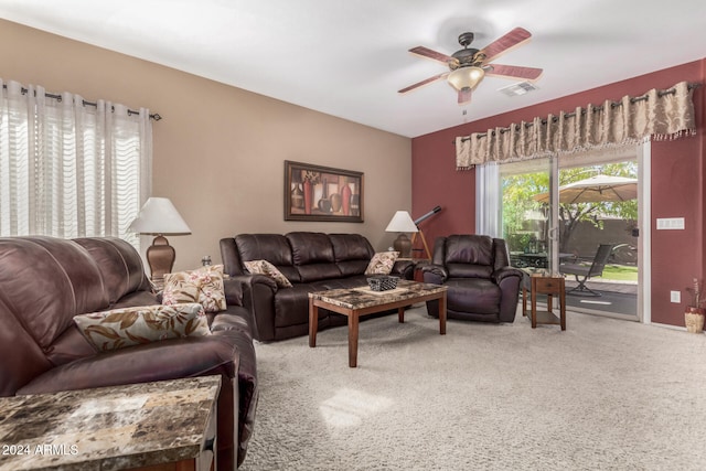 living room with ceiling fan and carpet flooring