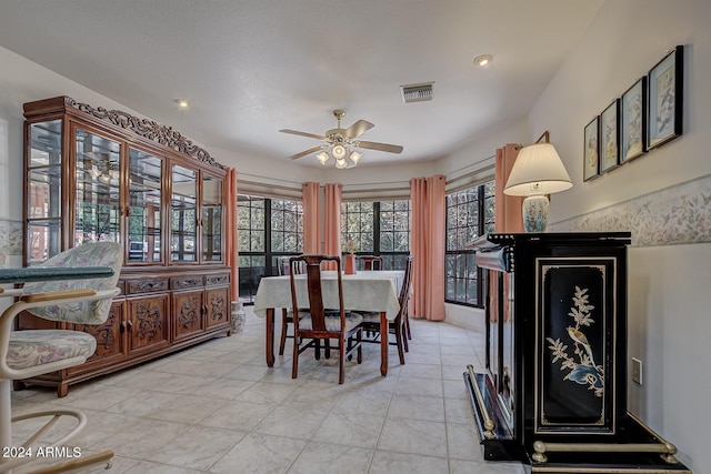 dining space with ceiling fan and visible vents