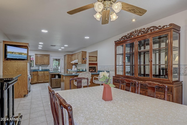 dining room featuring light tile patterned floors, ceiling fan, and recessed lighting