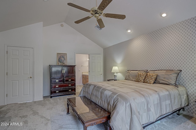 bedroom with connected bathroom, light colored carpet, visible vents, a ceiling fan, and wallpapered walls