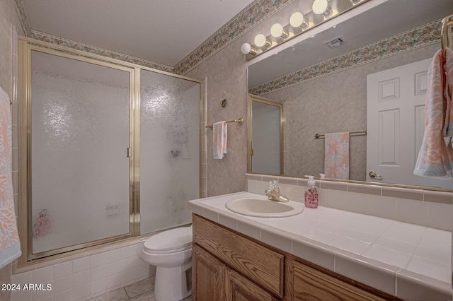 bathroom featuring toilet, wallpapered walls, visible vents, and vanity