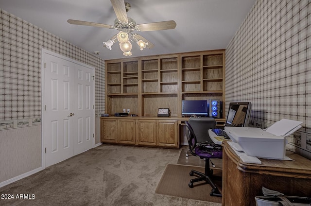 office area featuring light carpet, wallpapered walls, baseboards, and a ceiling fan