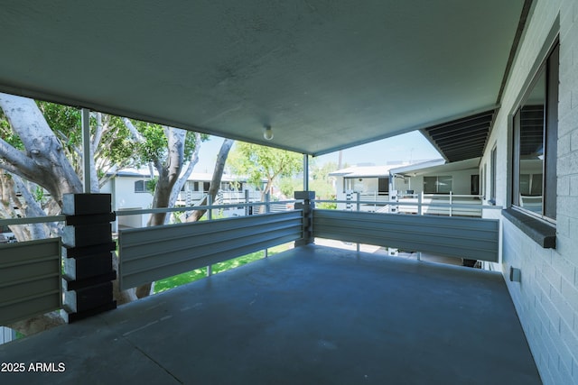 view of patio featuring a balcony
