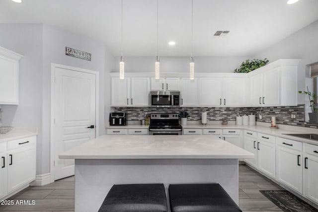 23848 W Grove St, Buckeye, AZ 85326 - kitchen featuring stainless steel appliances, recessed lighting, and decorative backsplash