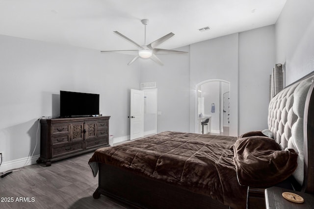 23848 W Grove St, Buckeye, AZ 85326 - bedroom featuring arched walkways, visible vents, baseboards, and wood finished floors