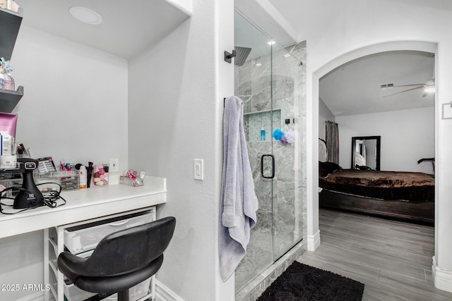 23848 W Grove St, Buckeye, AZ 85326 - bathroom with visible vents, baseboards, a ceiling fan, connected bathroom, and a stall shower