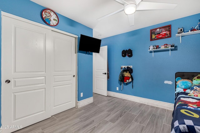 23848 W Grove St, Buckeye, AZ 85326 - bedroom featuring a closet, baseboards, a ceiling fan, and wood finished floors